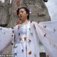 Illustration for article titled Dress Made of Live Butterflies Won't Let You Fly